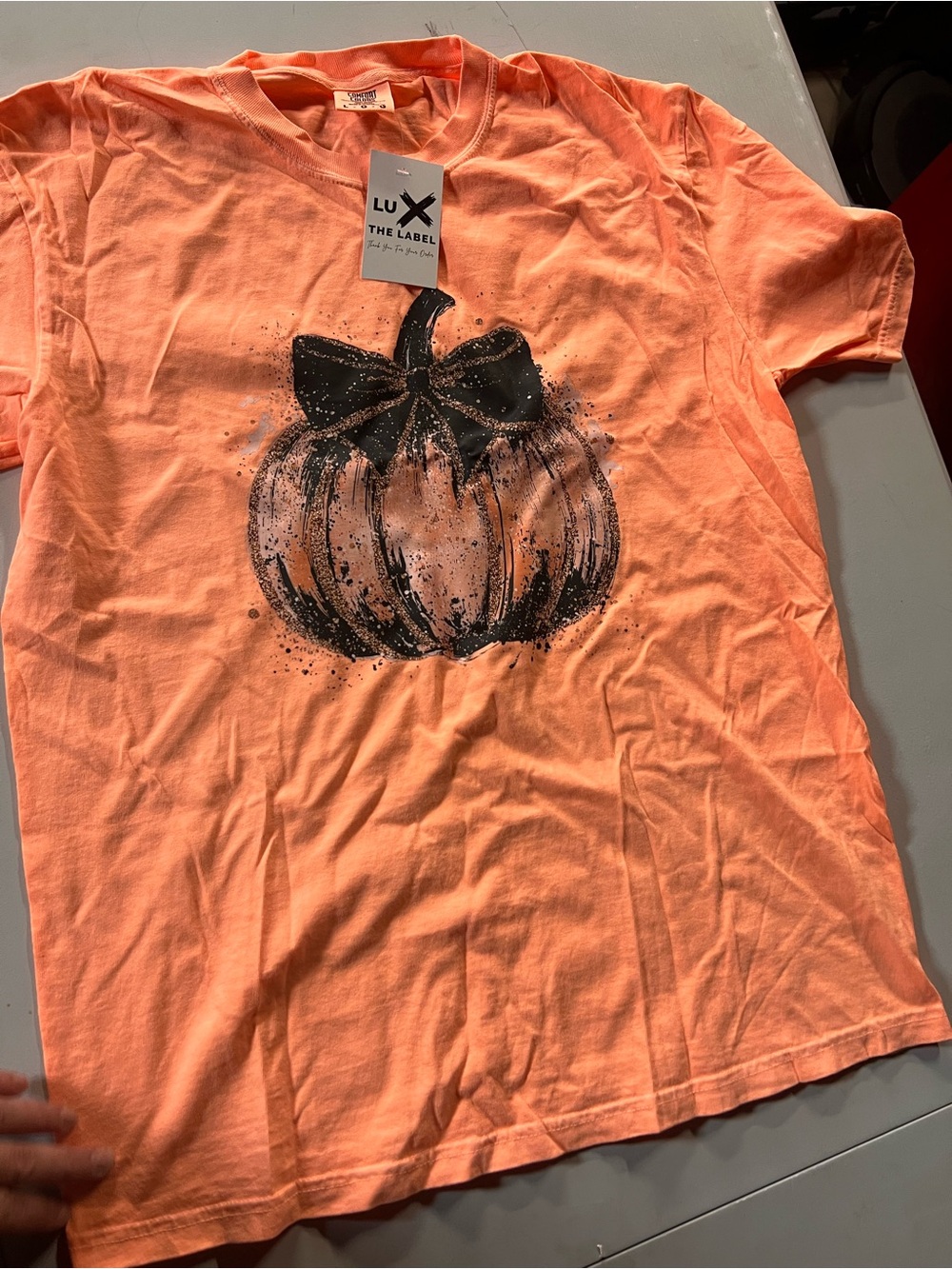 Comfort Colors Peach-Orange Tee with Black Pumpkin Graphic